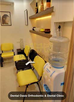 Image of Dental Oasis Orthodontics & Dental Clinic, with white background and water purifier facility.